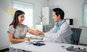 A doctor doing annual physical check up of a female patient